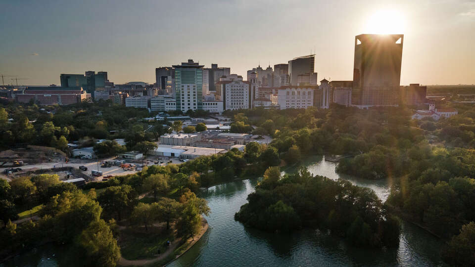 The Texas Medical Center seen from McGovern Lake in Hermann Park on Friday, Nov. 6, 2020, in Houston. Major institutions that have sponsored H-1B visas include top-tier medical and research organizations.