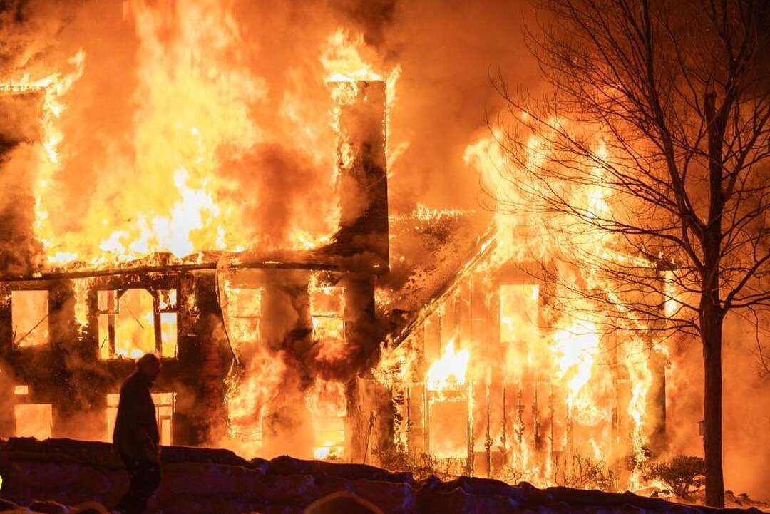 Stricken man dies after being found outside Tolland house fire