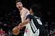 San Antonio Spurs guard Stephon Castle (5) defends against Houston Rockets center Alperen Sengun during the second half of an NBA basketball game in Houston, Wednesday, Jan. 28, 2026. (AP Photo/Ashley Landis)