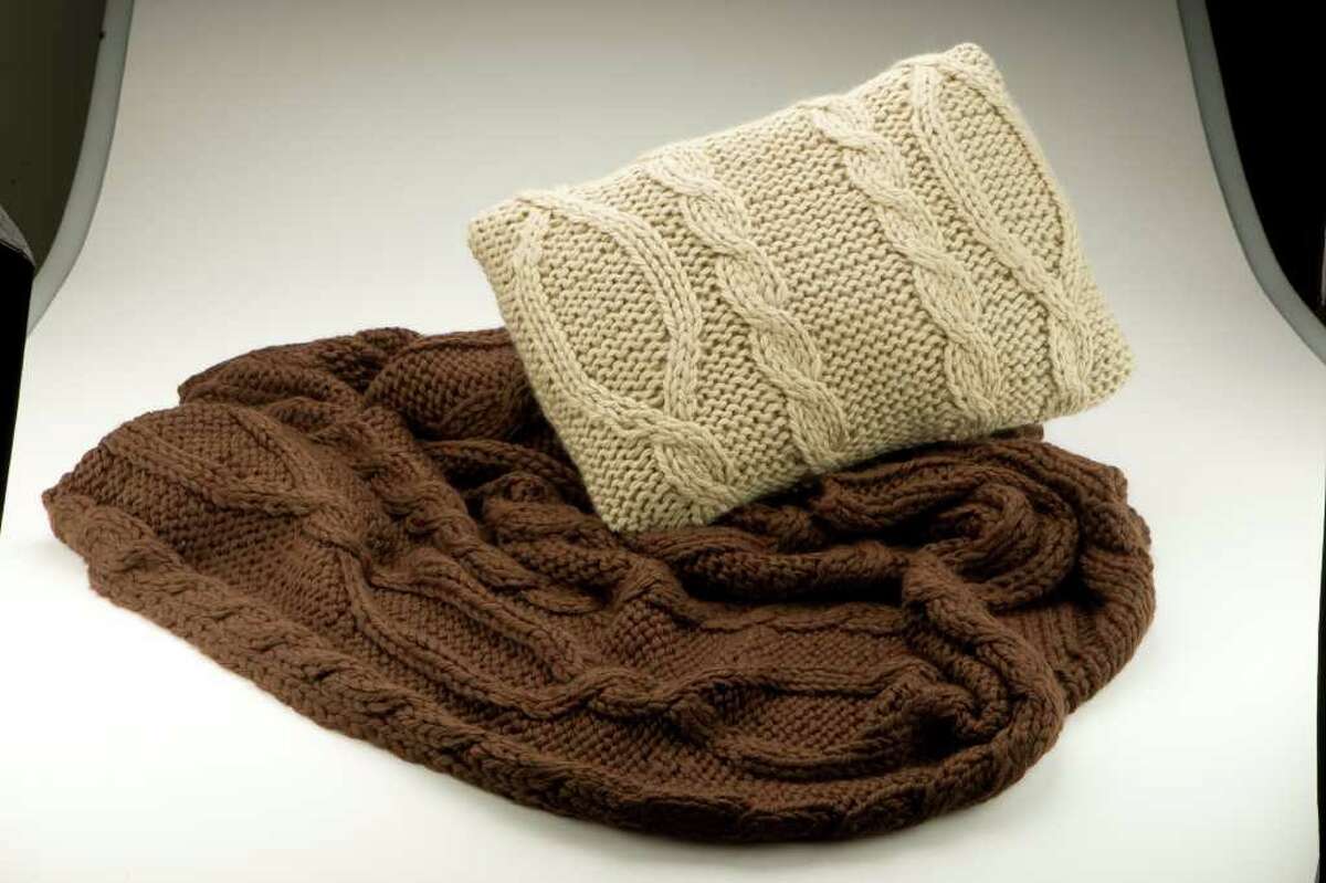 Martha stewart chunky cable blanket, brown and Martha Stewart chunky cable pillow. Photographed Wednesday, Nov. 10, 2010, in the Chronicle studio in Houston. ( Nick de la Torre / Houston Chronicle )