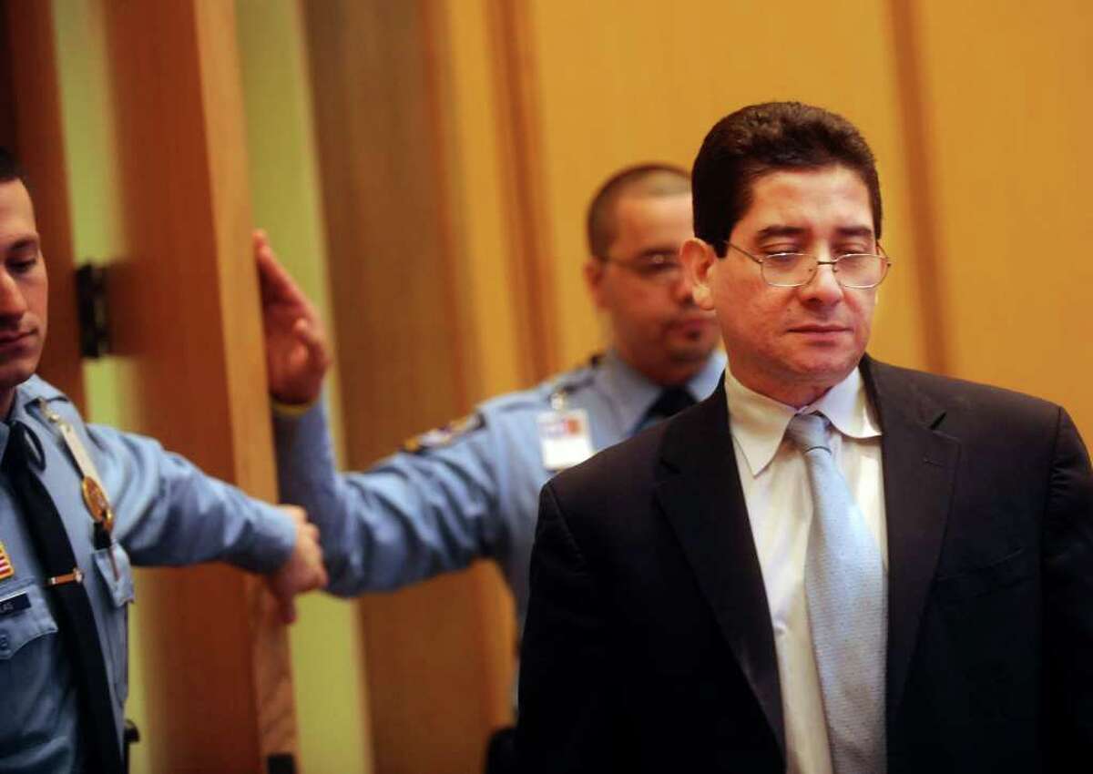 Carlos Trujillo, right, at his trial in which he is accused in the slaying of Andrew Kissel, at state Superior Court in Stamford on Thursday, Dec. 9, 2010.