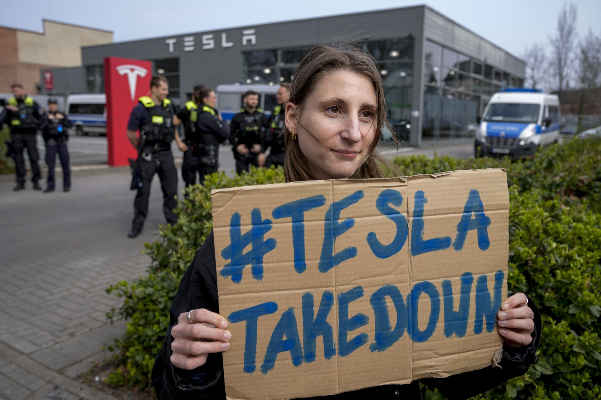 Tesla Outrage Protesters at Tesla showrooms decry Musk's purge of US government