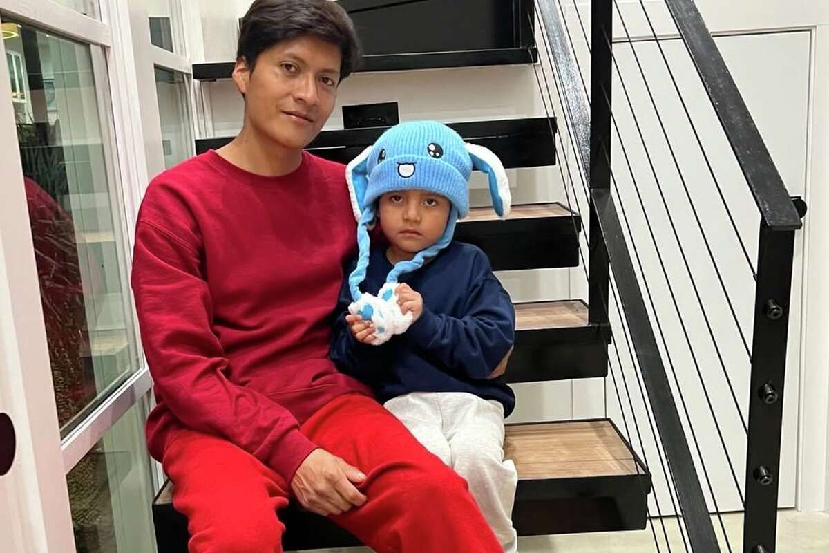 Liam Conejo Ramos sits with his father, Adrian Conejo Arias, after their release from an immigration detention in Dilley, Texas.