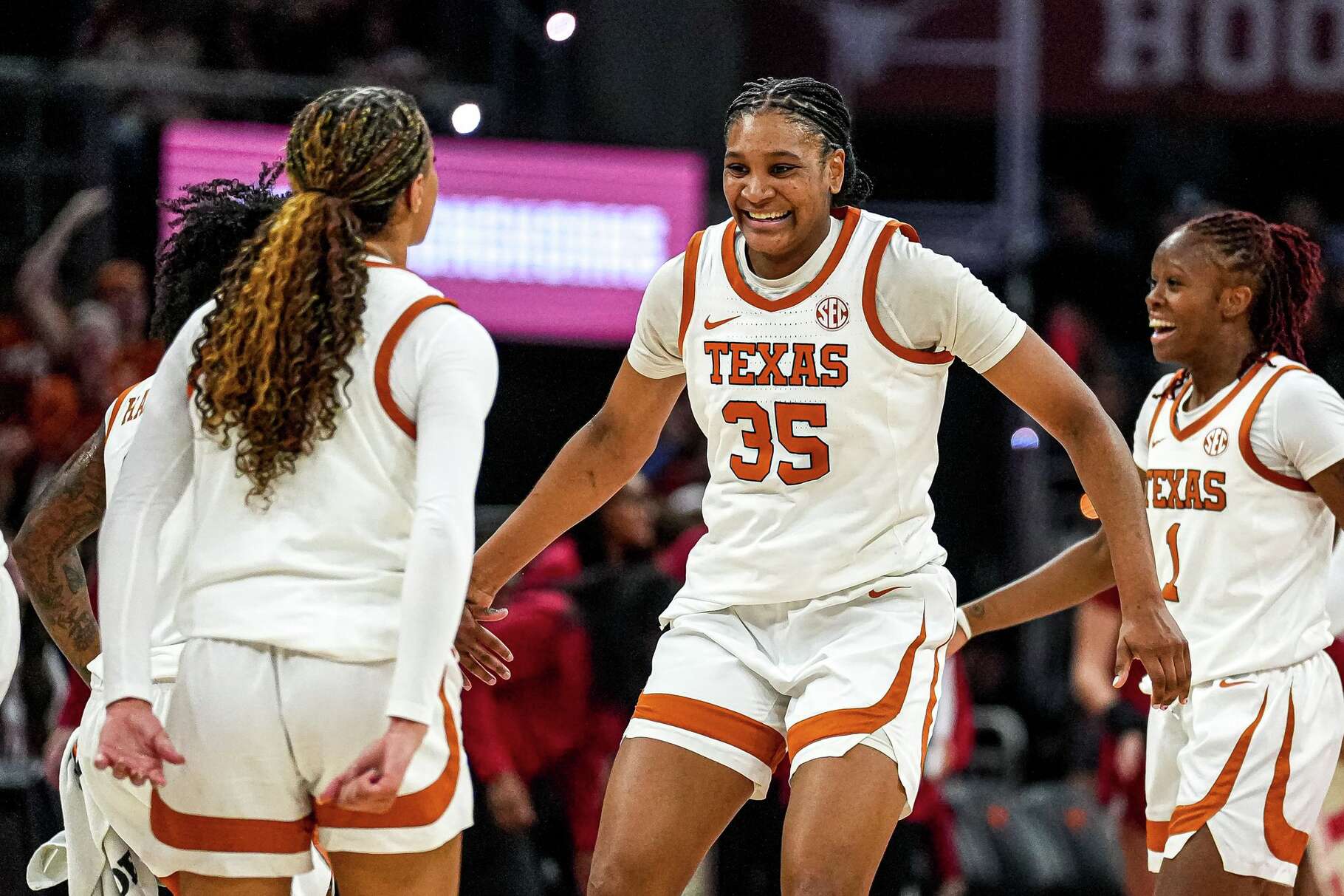 Texas Longhorns guard Madison Booker (35) and guard Jordan Lee (7) celebrate during an Oklahoma timeout in the game at the Moody Center on Sunday, Feb. 1, 2026 in Austin.