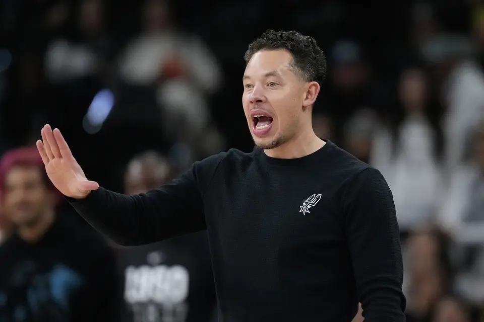 San Antonio Spurs head coach Mitch Johnson signals to his players during the second half of an NBA basketball game against the Orlando Magic in San Antonio, Sunday, Feb. 1, 2026.