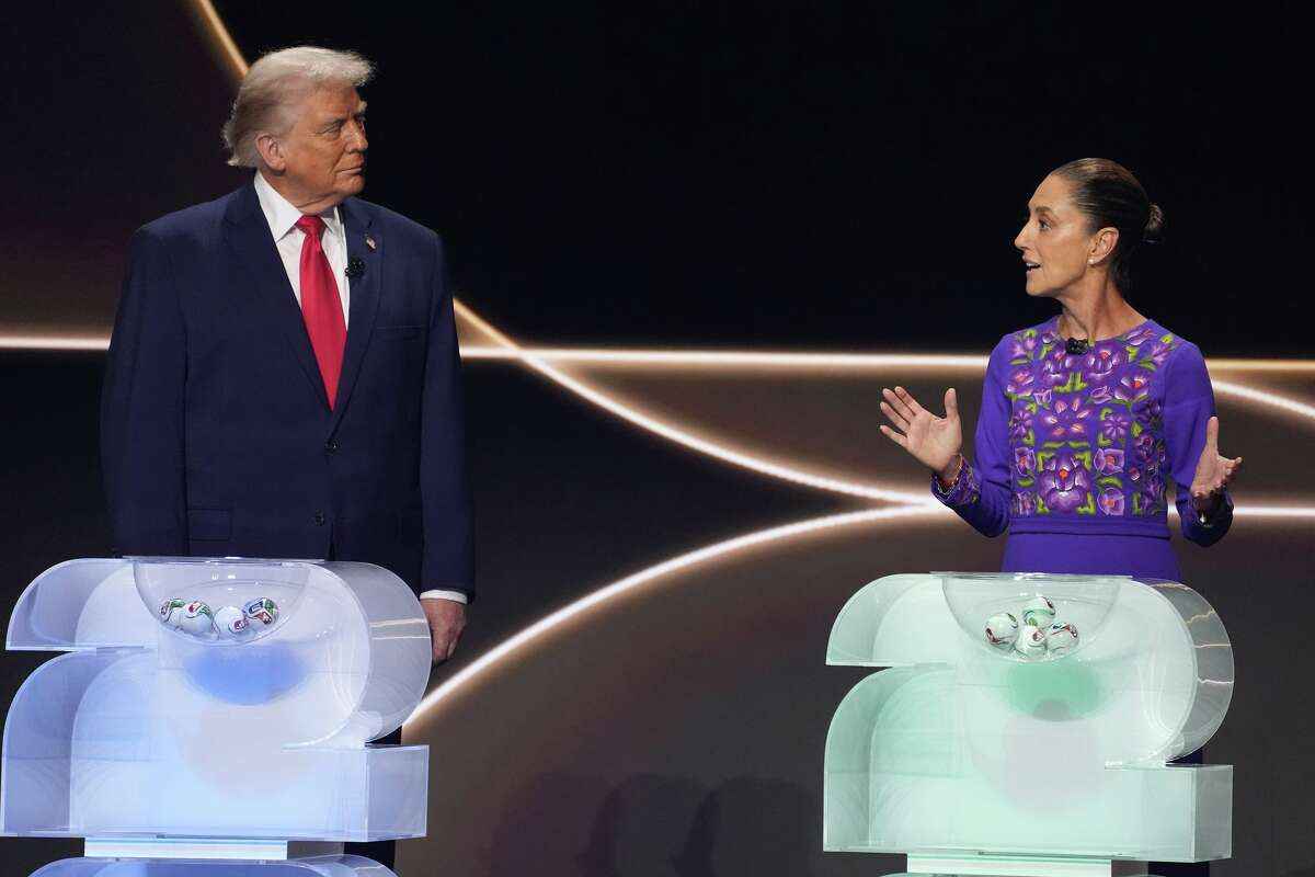 FILE - Mexican President Claudia Sheinbaum, right, speaks as President Donald Trump, left, stands on stage during the draw for the 2026 soccer World Cup at the Kennedy Center in Washington, Dec. 5, 2025.