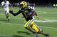 Holy Cross' Dae'Sean Graves (1) carries the ball during high school football action against Oxford in Waterbury, Conn. on Thursday October 2, 2025.