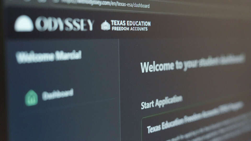 Marcia Pena works to apply for a Texas Education Freedom Account voucher for her daughter's catholic school next year in Houston, Wednesday, Feb. 4, 2026. Wednesday was the first day that the applications opened for parents to take part in Texas' new program to utilize tax dollars as part of school choice.