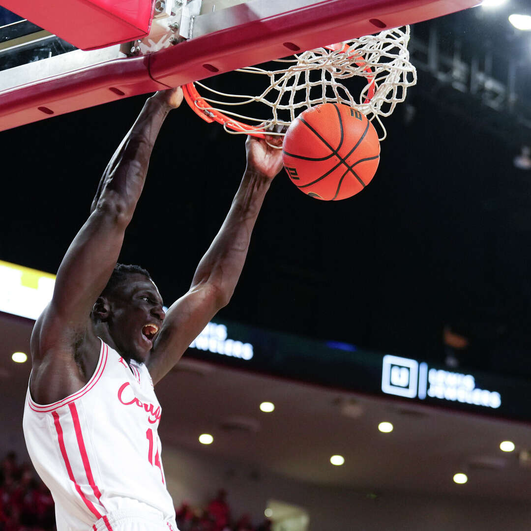 Houston forward Kalifa Sakho (14) reacts after dunking the ball during the second half of an NCAA college basketball game in Houston, Wednesday, Feb. 4, 2026.