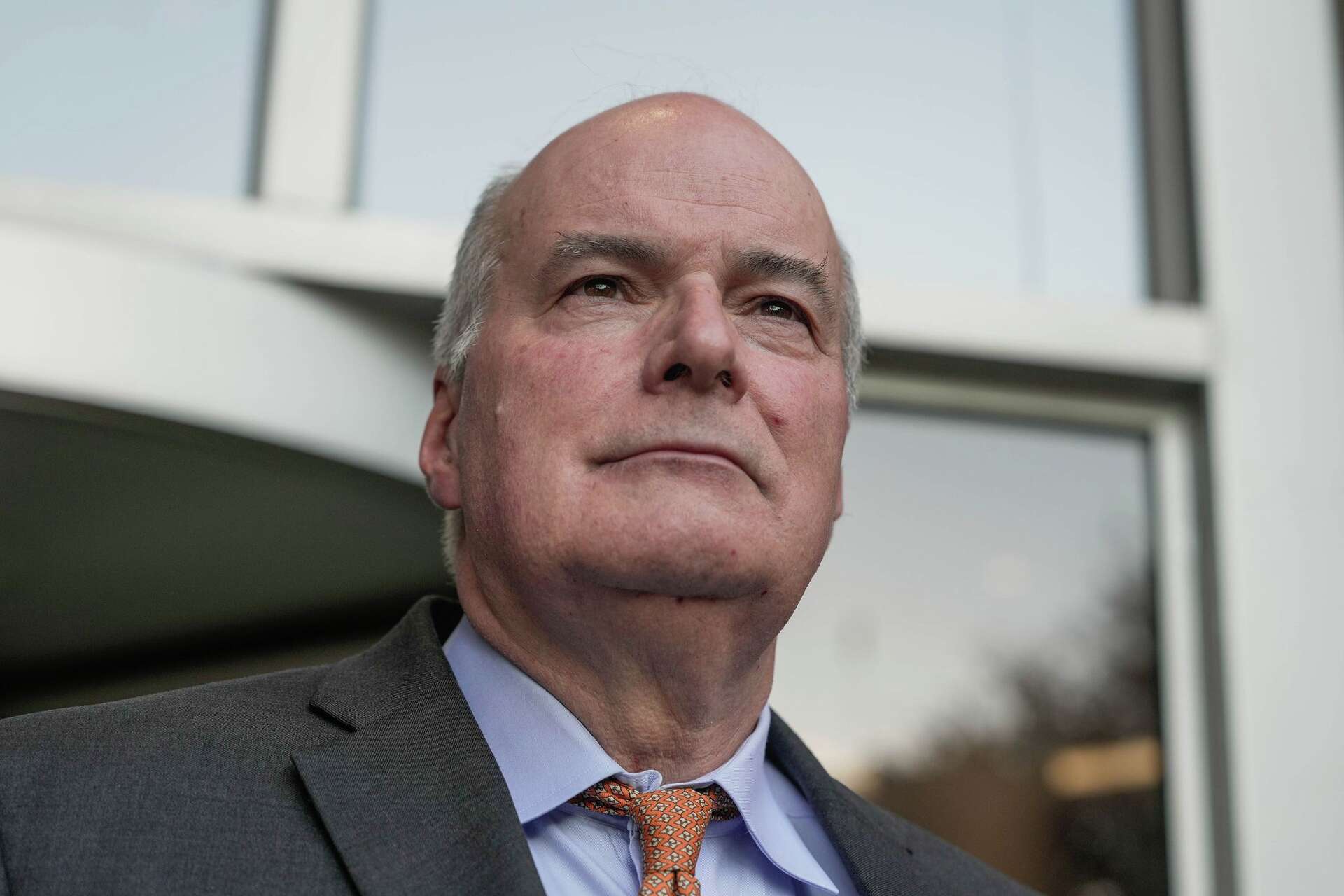 Dr. John Stevenson Bynon Jr. exits federal court after a hearing on charges alleging he made false statements that rendered patients functionally ineligible for