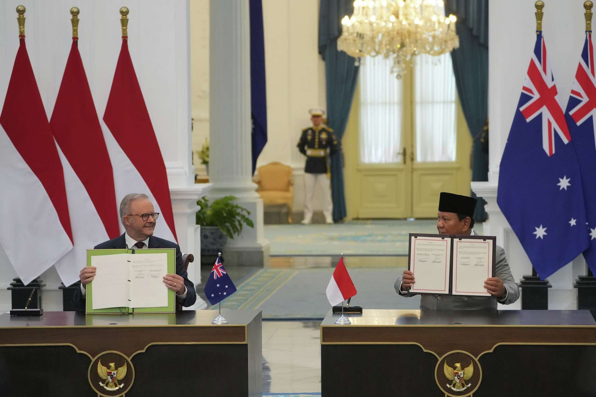 Leaders of Indonesia and Australia sign a new security treaty to affirm ...