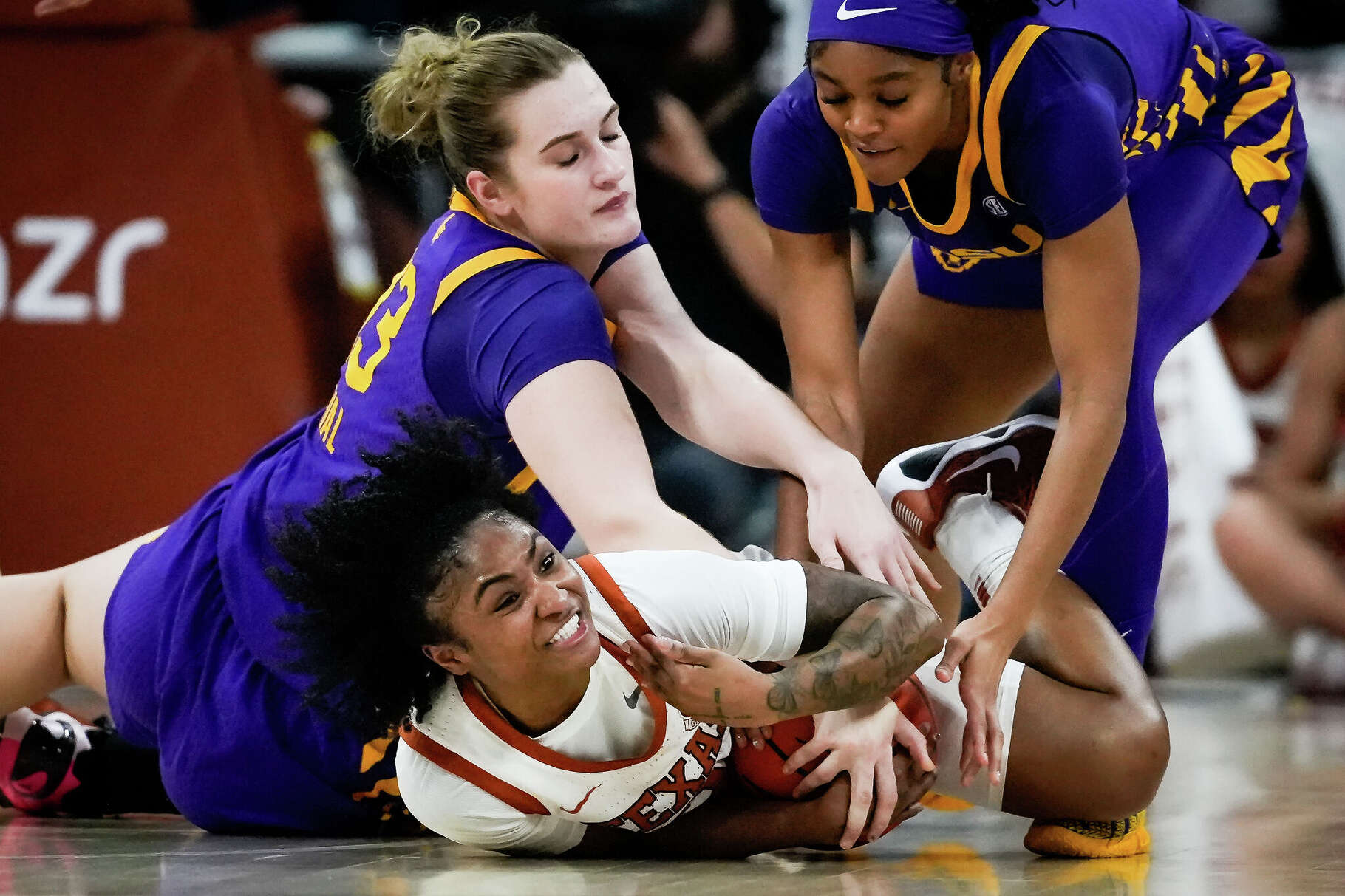Texas Longhorns guard Rori Harmon (3) battles Louisiana State defend in the third quarter of the Longhorns' game against the LSU Tigers at the Moody Center in Austin, Feb. 5, 2026. Texas won the game 77-64.