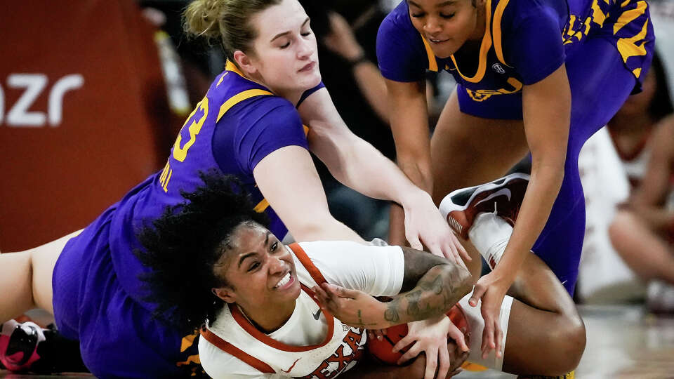 Texas Longhorns guard Rori Harmon (3) battles Louisiana State defend in the third quarter of the Longhorns' game against the LSU Tigers at the Moody Center in Austin, Feb. 5, 2026. Texas won the game 77-64.