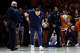 An officer tries to restrain Mississippi head coach Chris Beard as he runs back onto the court after being ejected during the second half of an NCAA college basketball game against Tennessee, Tuesday, Feb. 3, 2026, in Knoxville, Tenn.