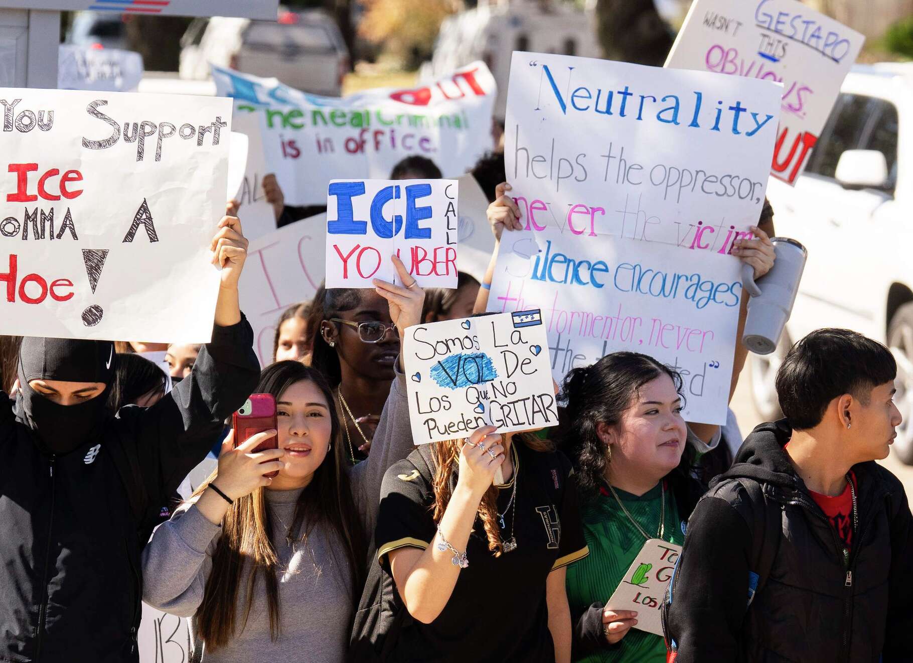 Bellaire High School students take part in a walkout to protest against ICE, despite threats from Gov. Greg Abbott and the Texas Education Agency, Friday, Feb. 6, 2026, in Houston. Abbott warned students, teachers and school could face serious consequences for acts of activism during the school day.
