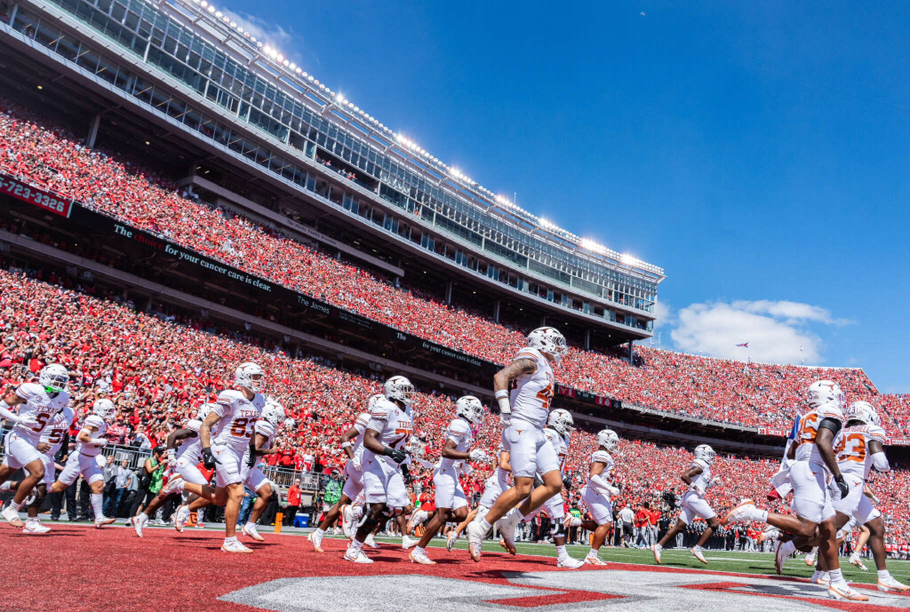 The Texas Longhorns take the field ahead of their game against the Ohio State Buckeyes at Ohio Stadium in Columbus, Aug. 30, 2025.