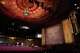 The interior of the Castro Theatre features restored artwork on the ceiling and walls and rows of removable seats.