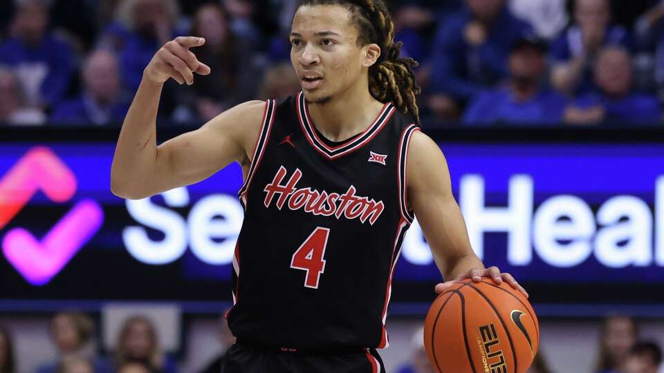 Houston guard Kingston Flemings brings the ball up the court against BYU during the second half of an NCAA college basketball game, Saturday, Feb. 7, 2026, in Provo, Utah. (AP Photo/Rob Gray)