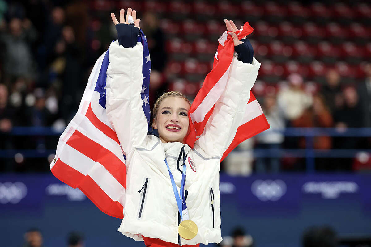 MILAN, ITALY - FEBRUARY 08: Gold medalist Amber Glenn of Team United States celebrates after the medal ceremony for the Team Event on day two of the Milano Cortina 2026 Winter Olympic games at Milano Ice Skating Arena on February 08, 2026 in Milan, Italy. (Photo by Elsa/Getty Images)