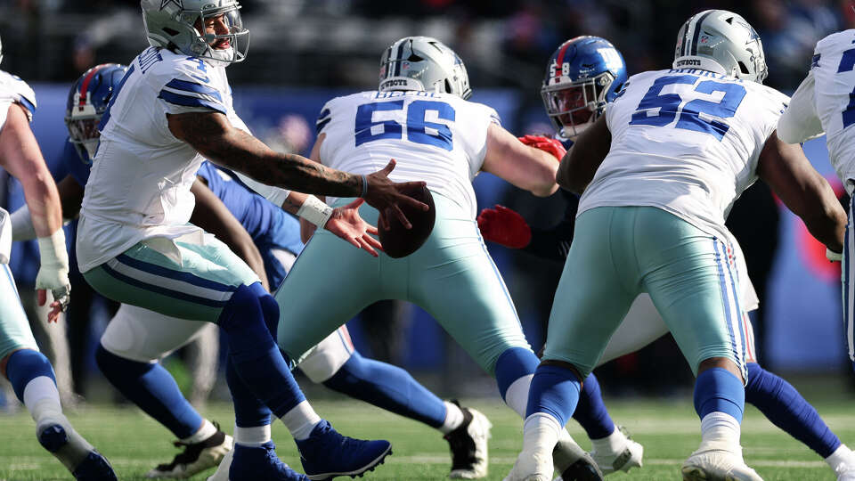 Dak Prescott of the Dallas Cowboys fumbles the ball during a game against the New York Giants at MetLife Stadium on January 4, 2026 in East Rutherford, New Jersey. The New York Giants won 34-17.