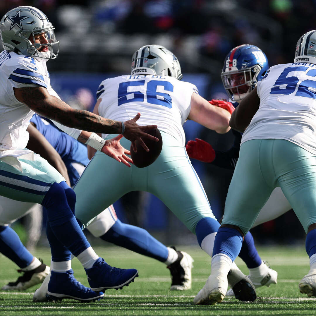 Dak Prescott of the Dallas Cowboys fumbles the ball during a game against the New York Giants at MetLife Stadium on January 4, 2026 in East Rutherford, New Jersey. The New York Giants won 34-17.