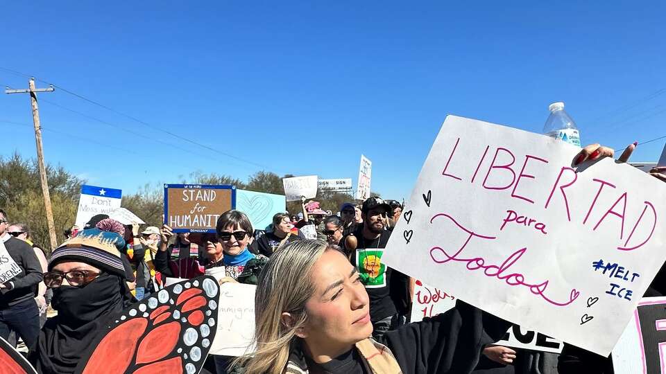 Houston resident Frida Adame joined hundred of people outside Dilley Immigration Processing Center in Dilley, Texas, on January 28 to protest the Trump administration's immigration crackdown.  