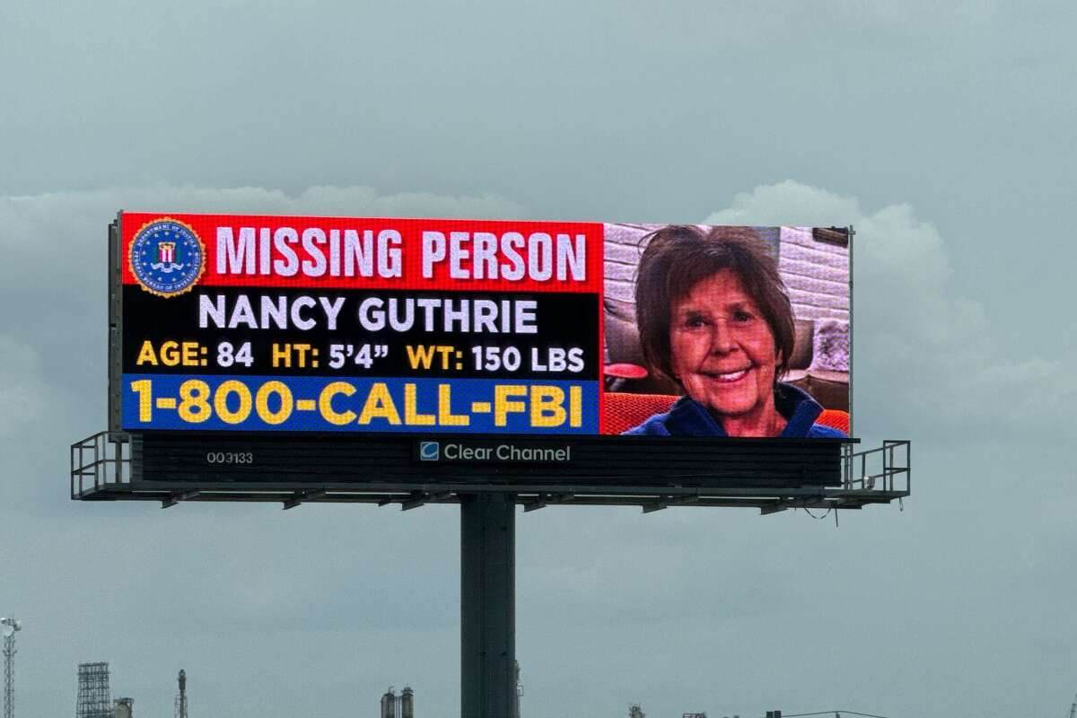 A missing-person billboard for Nancy Guthrie on Highway 225 in Pasadena.