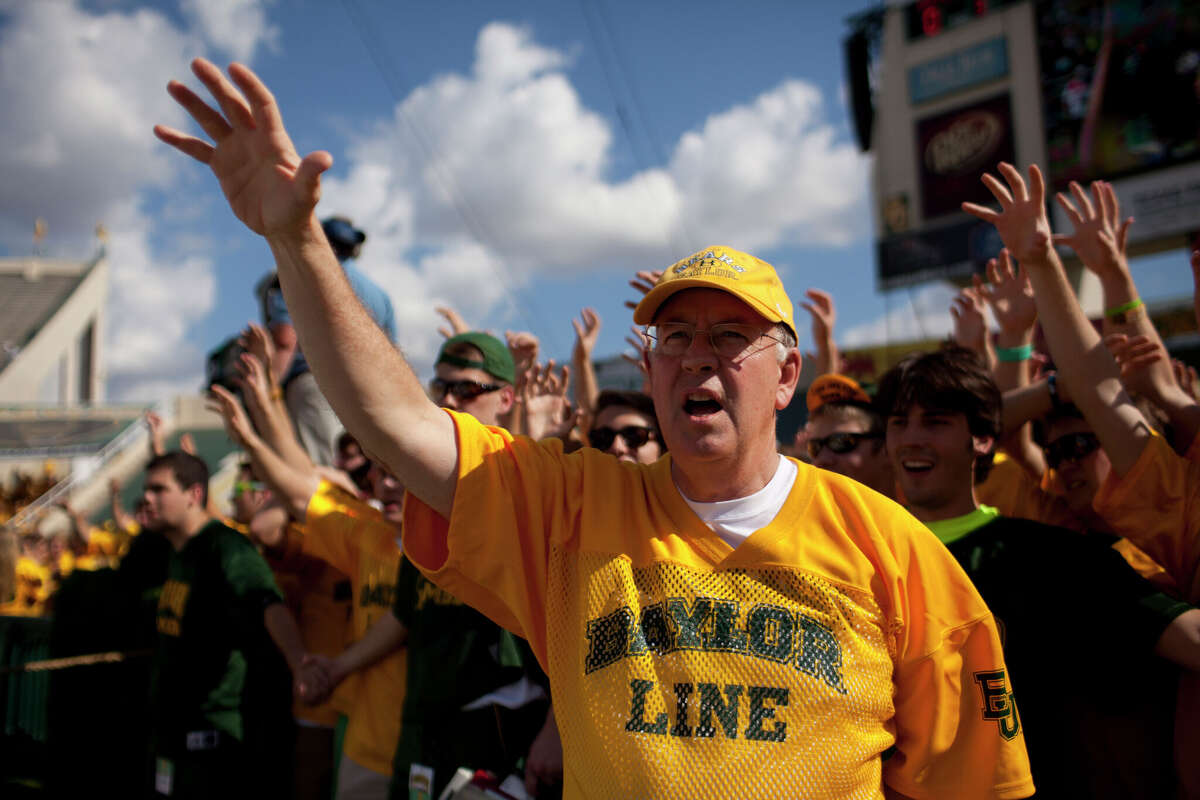 Baylor University President Ken Starr cheers with students prior to kickoff against the University of Kansas Jayhawks on November 3, 2012 at Floyd Casey Stadium in Waco, Texas. 