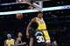 Los Angeles Lakers forward Rui Hachimura (28) descends after making a dunk during the second half of an NBA basketball game against the San Antonio Spurs Tuesday, Feb. 10, 2026, in Los Angeles. (AP Photo/Jae C. Hong)