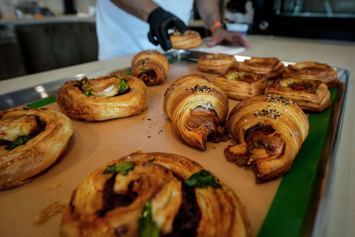 Efrain Ayllon sorts pastries at Yemex Bakehouse & Specialty Coffee, a new Mexican-Yemeni cafe, opening in Houston, Wednesday, Feb. 11, 2026.