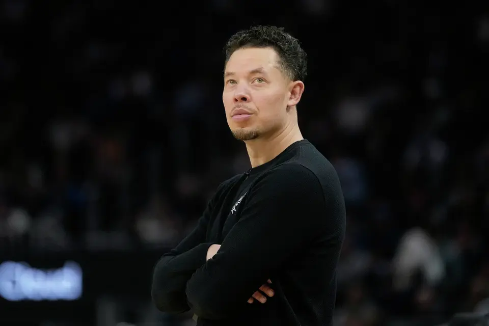 San Antonio Spurs head coach Mitch Johnson watches from the sideline during the first half of an NBA basketball game against the Golden State Warriors in San Francisco, Wednesday, Feb. 11, 2026. (AP Photo/Jeff Chiu)