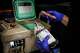 Fort Worth Fire Department Capt. Trent Robinson logs the condition and temperature of a unit of blood carried in a cooler in his vehicle between calls. The department has initiated a mobile blood program, which has delivered blood to hemorrhaging patients in the field since April.