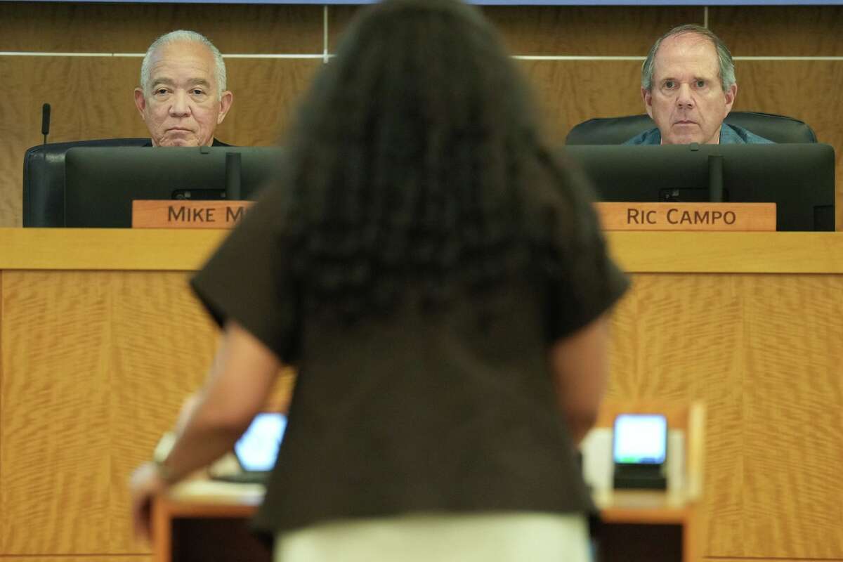 Houston ISD school board superintendent Mike Miles, left, and president Ric Campo listen to a speaker during the board's meeting at the Hattie Mae White Building in Houston on Thursday, Feb. 12, 2026.