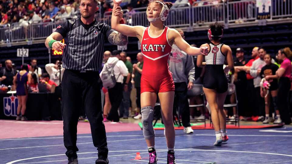 Katy's Emily Beltran wins her match over Emily Malbrough, of Killeen Harker Heights, during the UIL State Wrestling Championships at Berry Center in Houston, Friday, Feb. 13, 2026.