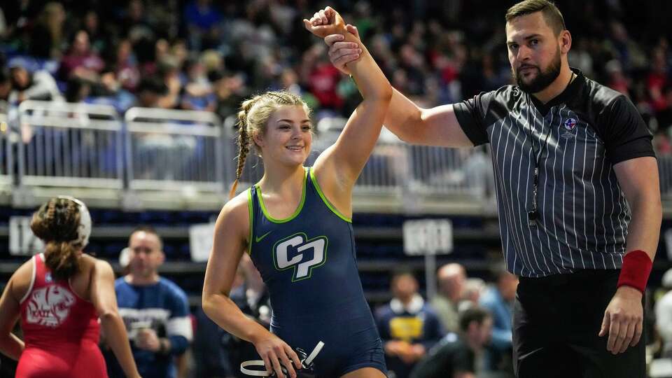 College Park's Landri Von Gonten wins her match over Katy's Jaclyn Fonseca during the UIL State Wrestling Championships at Berry Center in Houston, Friday, Feb. 13, 2026.