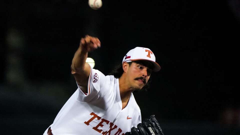 Texas Longhorns pitcher Ruger Riojas (13) throws a pitch during the game against UC Davis at UFCU Disch-Falk Field on Friday, Feb. 13, 2026 in Austin.