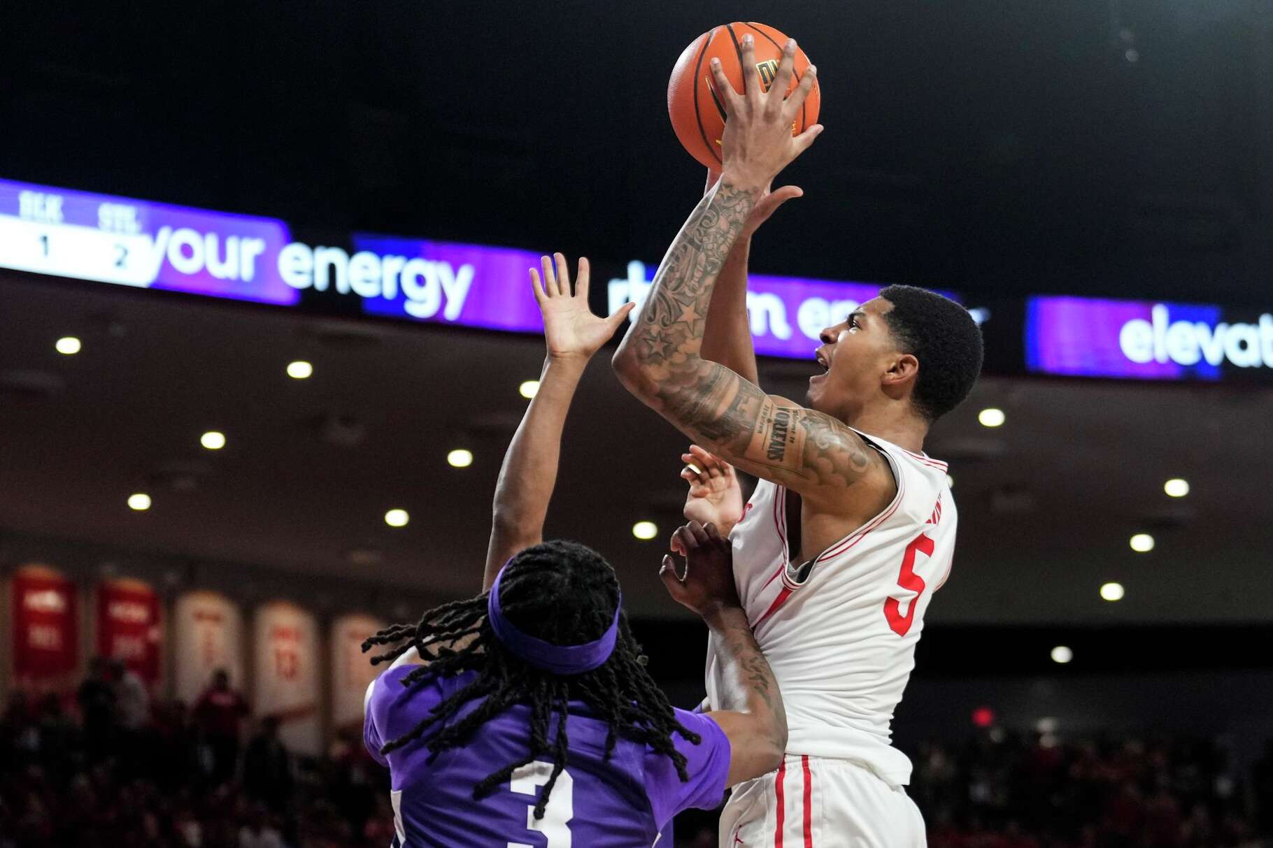 Houston center Chris Cenac Jr. (5) takes a shot over Kansas State guard CJ Jones (3) 0during the first half of an NCAA college basketball game at Fertitta Center in Houston, Saturday, Feb. 14, 2026.