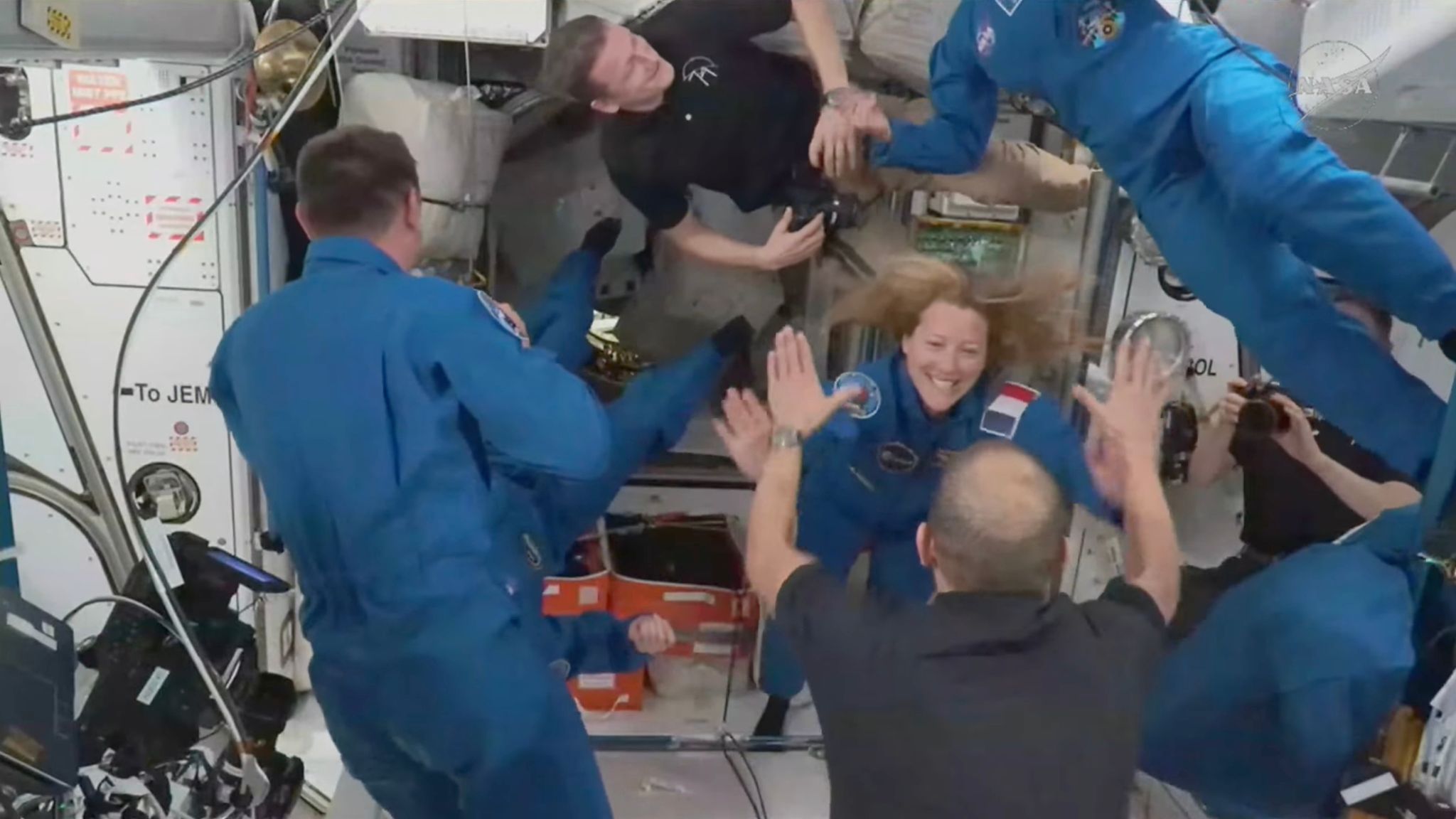 Four new astronauts arrive at the International Space Station to ...