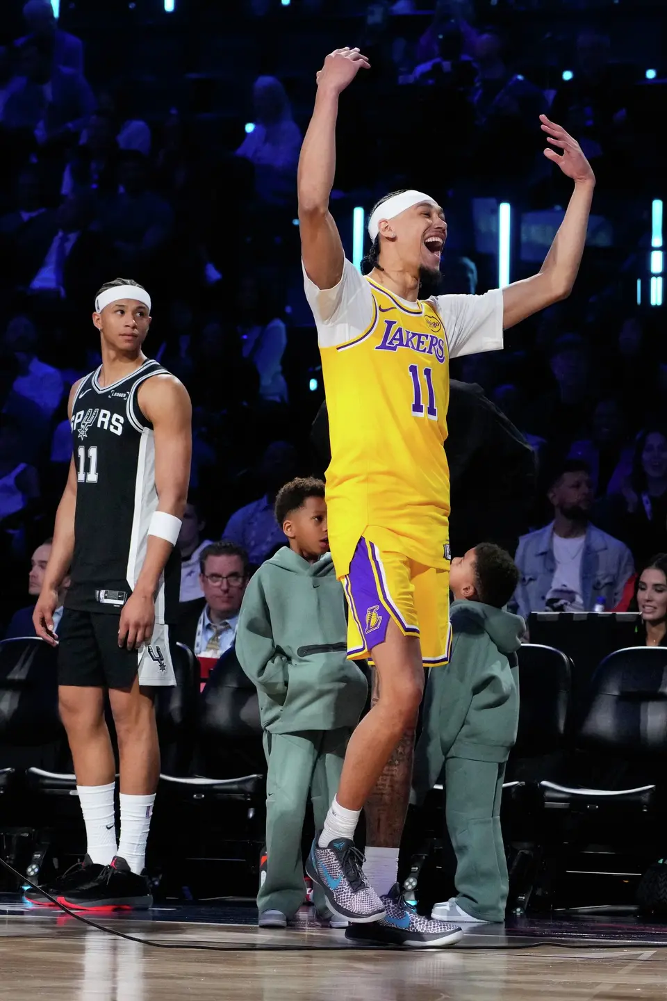 Los Angeles Lakers center Jaxson Hayes, right, reacts after a dunk next to San Antonio Spurs forward Carter Bryant during the slam dunk contest at the NBA basketball All-Star weekend festivities Saturday, Feb. 14, 2026, in Inglewood, Calif. (AP Photo/Mark J. Terrill)