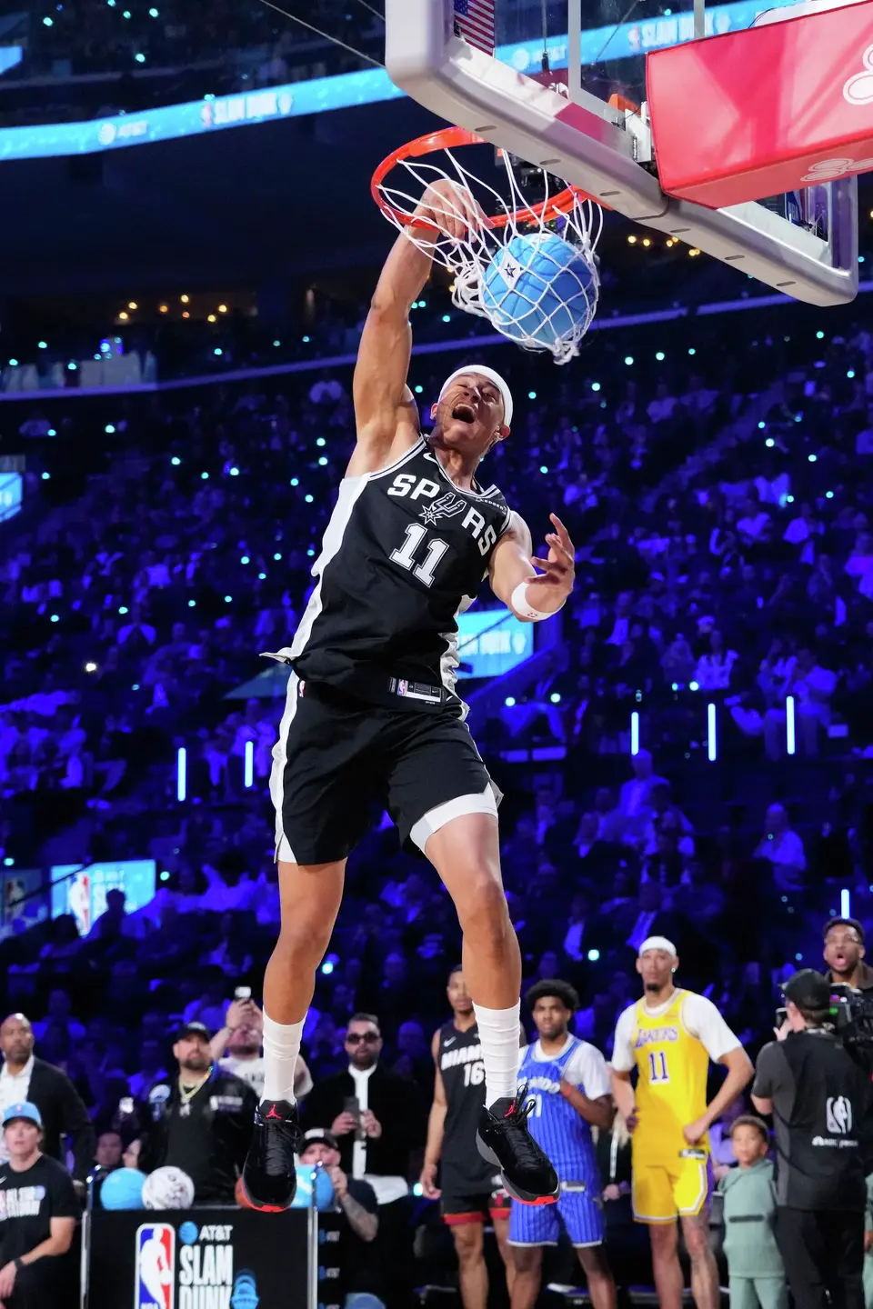 San Antonio Spurs forward Carter Bryant dunks during the slam dunk contest at the NBA basketball All-Star weekend festivities Saturday, Feb. 14, 2026, in Inglewood, Calif. (AP Photo/Mark J. Terrill)