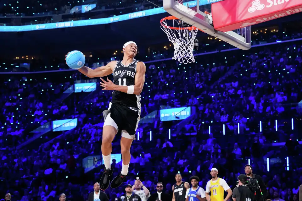 San Antonio Spurs forward Carter Bryant dunks during the slam dunk contest at the NBA basketball All-Star weekend festivities Saturday, Feb. 14, 2026, in Inglewood, Calif. (AP Photo/Mark J. Terrill)