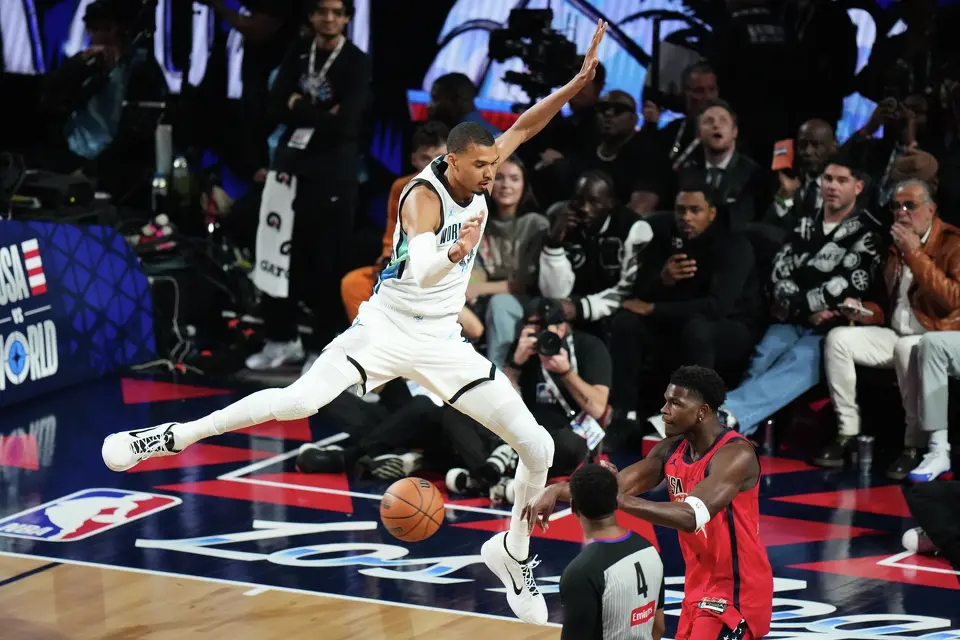 World center Victor Wembanyama, of France, defends on USA Stars guard Anthony Edwards during the NBA All-Star basketball game Sunday, Feb. 15, 2026, in Inglewood, Calif.