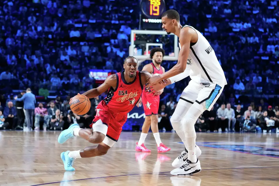 USA Stars guard Tyrese Maxey, left, is defended by World center Victor Wembanyama, of France, during the NBA All-Star basketball game Sunday, Feb. 15, 2026, in Inglewood, Calif. (AP Photo/Mark J. Terrill)