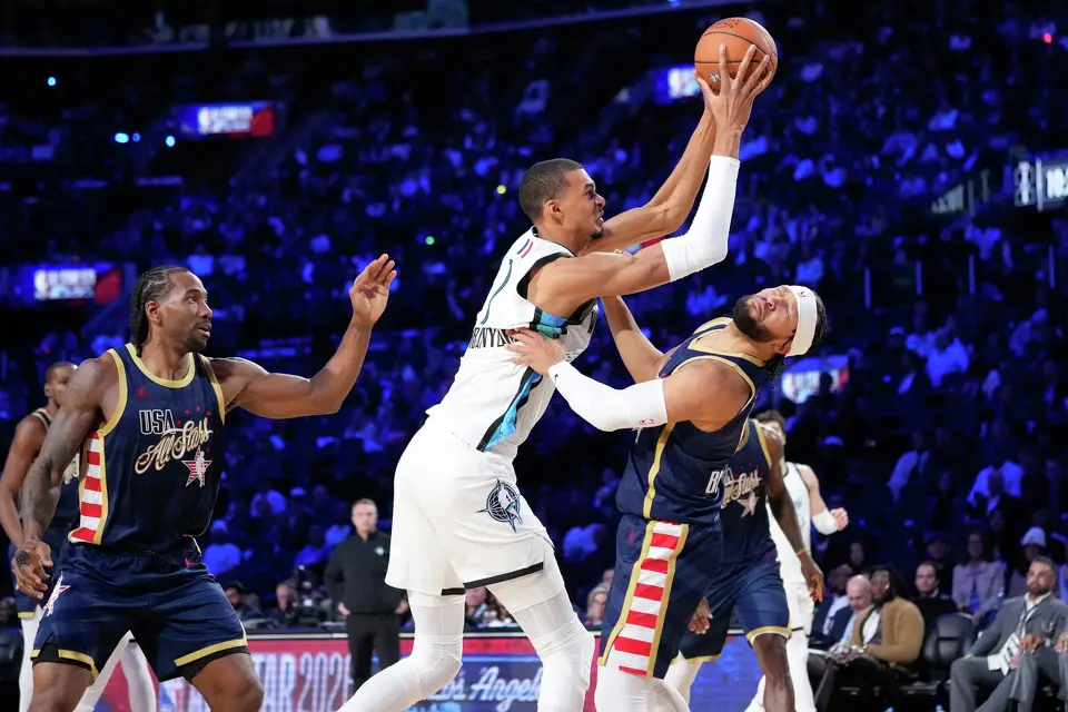 World center Victor Wembanyama, of France, shoots over USA Stripes guard Jalen Brunson during the NBA All-Star basketball game Sunday, Feb. 15, 2026, in Inglewood, Calif. (AP Photo/Mark J. Terrill)