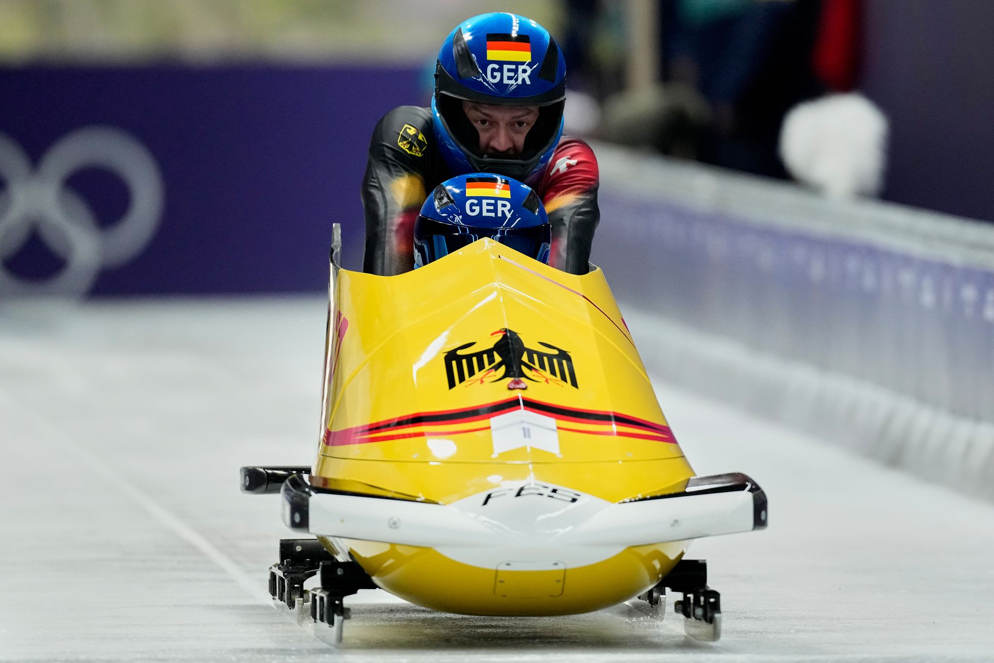 Germany's Johannes Lochner starts fast in Olympic 2-man bobsled race ...