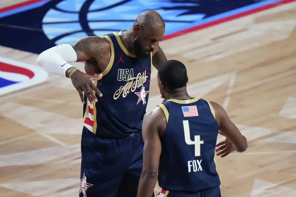 USA Stripes forward LeBron James celebrates with guard De'Aaron Fox (4) during the NBA All-Star basketball game against USA Stars Sunday, Feb. 15, 2026, in Inglewood, Calif. (AP Photo/Jae C. Hong)