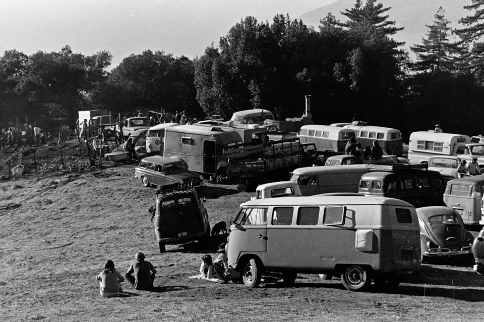 Cars and Volkswagon buses park for the 1973 Big Sur Harvest Party, a yearly festival in the mountains of Big Sur that celebrated the year’s cannabis harvest with a ceremonial burning of the largest cannabis plant of the year. The party would last all night with dancing, food and plenty of marijuana.