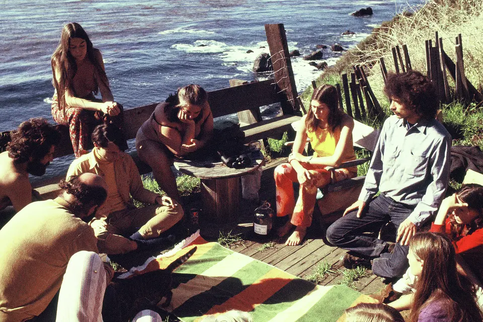 FILE: People gather on a deck overlooking the Pacific Ocean, at the Esalen Institute, in Big Sur, Calif., 1969.
