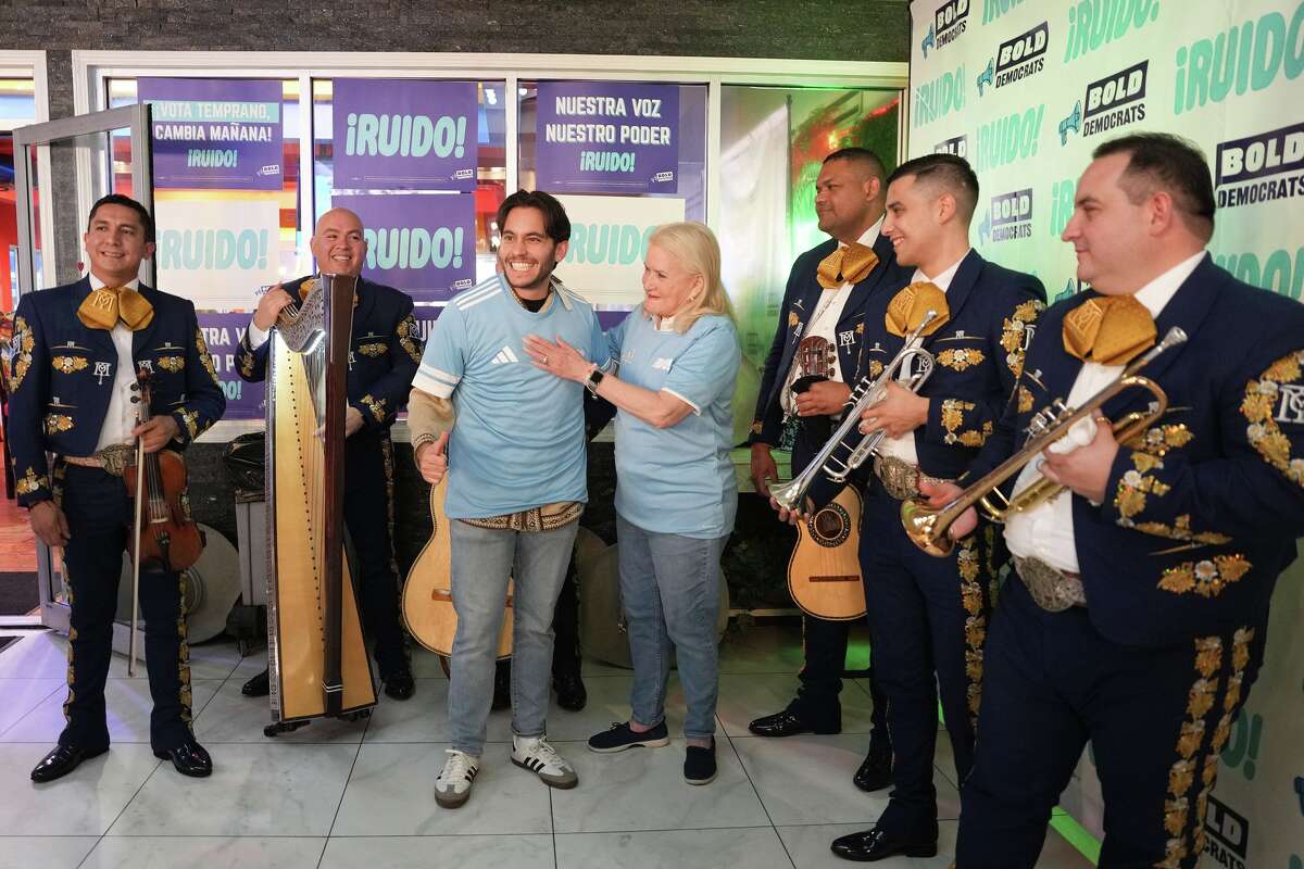 U.S. Rep. Sylvia Garcia prepares to pose for a photo with Carlos Espina during a creator event hosted by the PAC BOLD DEMOCRATS in Houston on Tuesday, Feb. 17, 2026. The PAC supports Hispanic candidates.