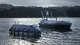 Shown is a "Spyglass" class autonomous boat, left, and a "Cutlass" class autonomous boat manufactured by Austin-based defense technology firm, Saronic Technologies.